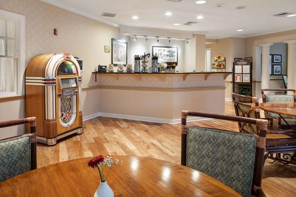 Common area with jukebox and dining tables