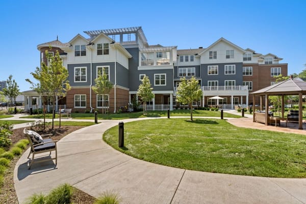 Exterior view of Sunrise of Newton with landscaped gardens