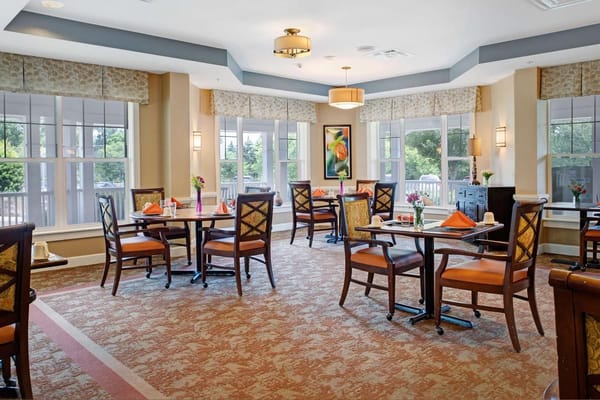 Bright dining area with tables set for meals