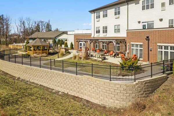 Outdoor space with seating and garden area at senior living facility
