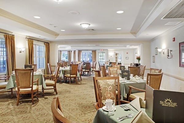 Cozy dining area with tables set for residents