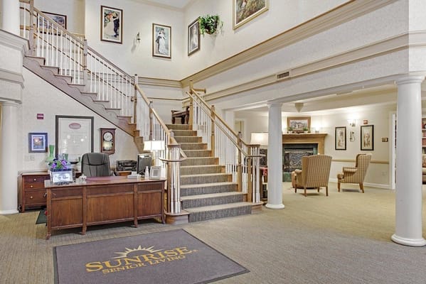 Lobby entrance with staircase and reception desk