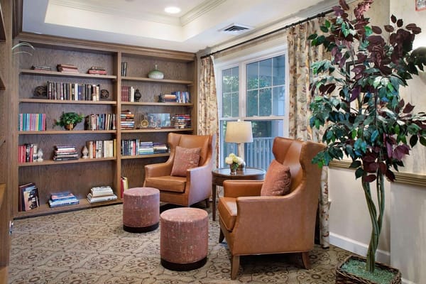 Cozy reading nook with bookshelves and seating