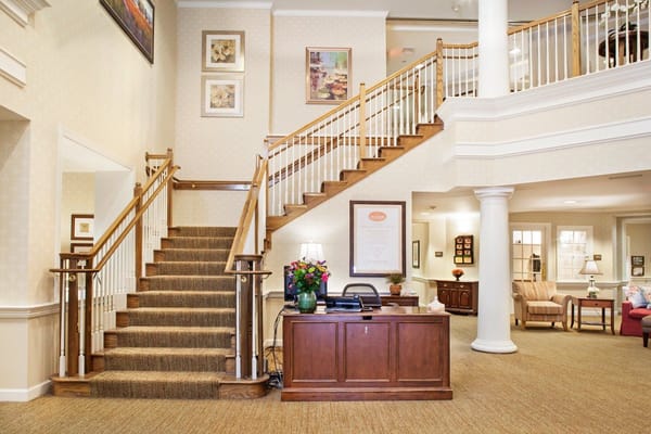 The lobby featuring a staircase and reception area