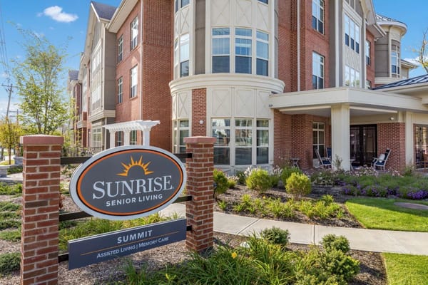 Exterior view of Sunrise of Summit facility with logo