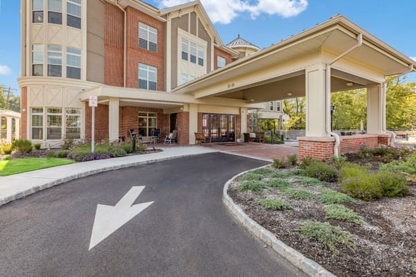 Entrance to a senior living facility with a covered drive