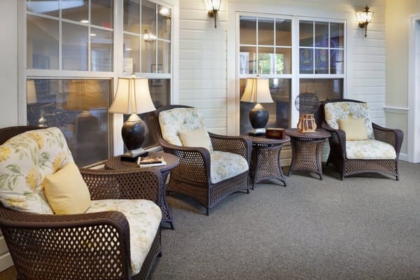 Cozy lounge area with wicker chairs and lamps