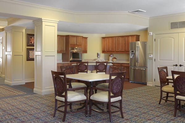 Interior view of a dining area with kitchen facilities