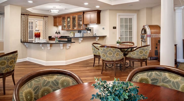 Lounge area featuring seating and a counter with beverages