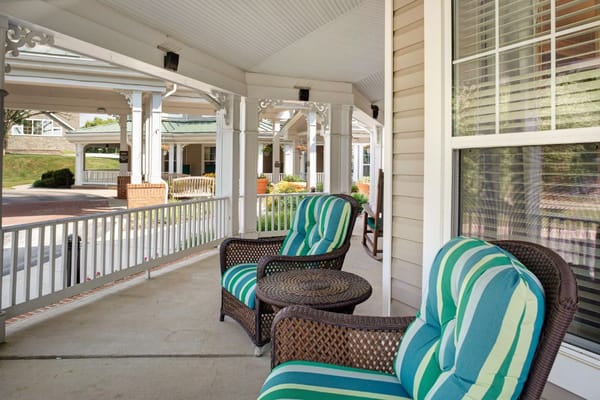 Seating area with striped cushions on the porch