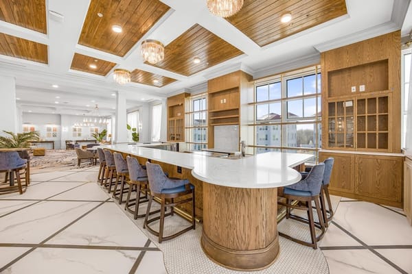 Elegant lounge with a bar and seating in Symphony Park