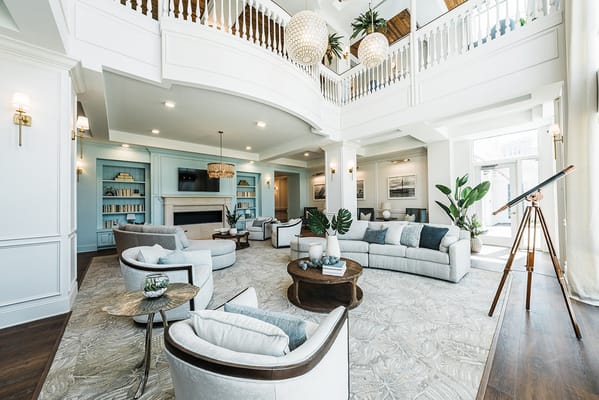 Spacious living room with modern furniture and light fixtures
