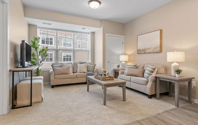 Inviting living room with comfortable seating and natural light