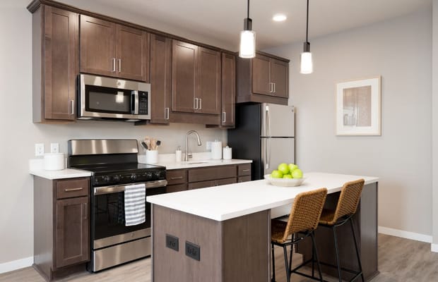 Spacious kitchen with modern appliances and island