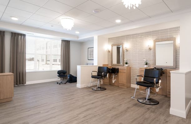 Interior view of the salon with styling stations and mirrors