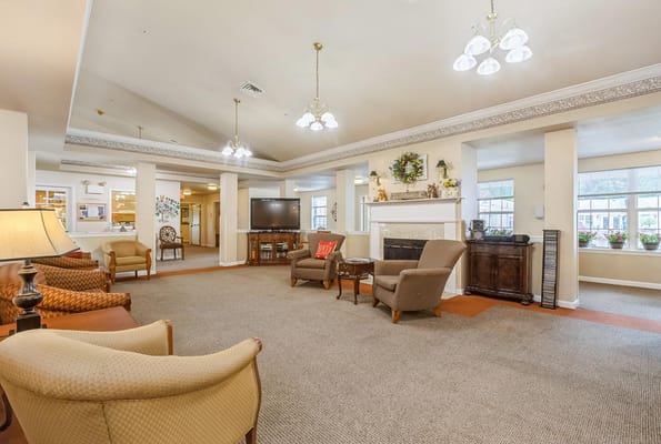 Spacious living room with seating and a fireplace