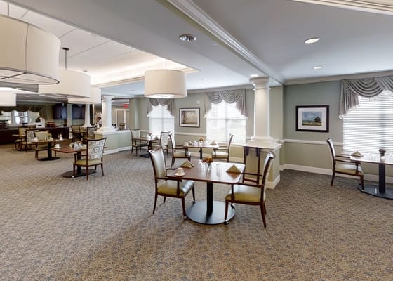 Dining room with tables set in a senior living facility