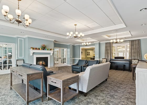 Spacious lounge with comfortable seating and fireplace