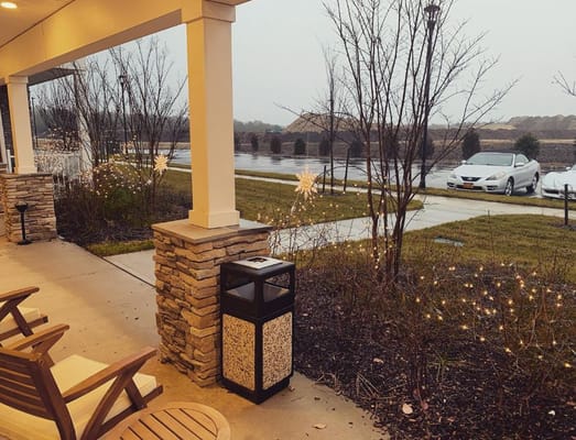 Wet patio area with lights and seating at The Chelsea at Brookhaven