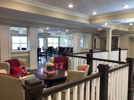 Comfortable seating in the common area with a view of dining space