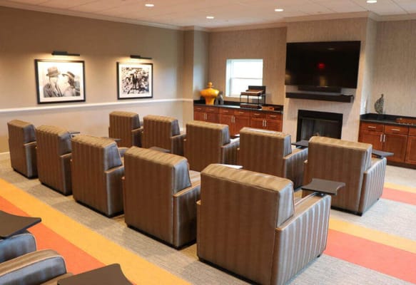 Cozy lounge area with comfortable seating and artwork