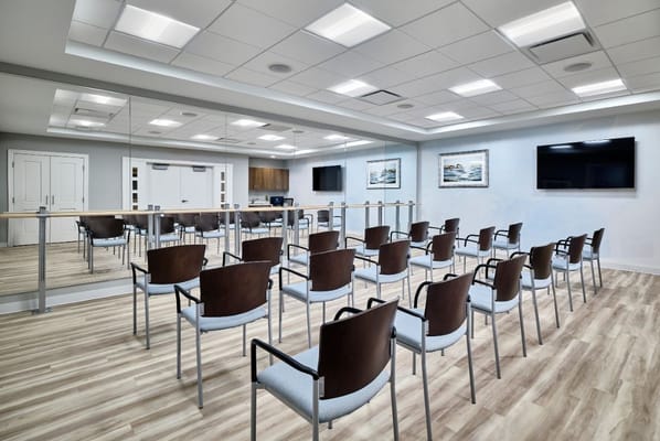 Empty conference room with chairs arranged in rows