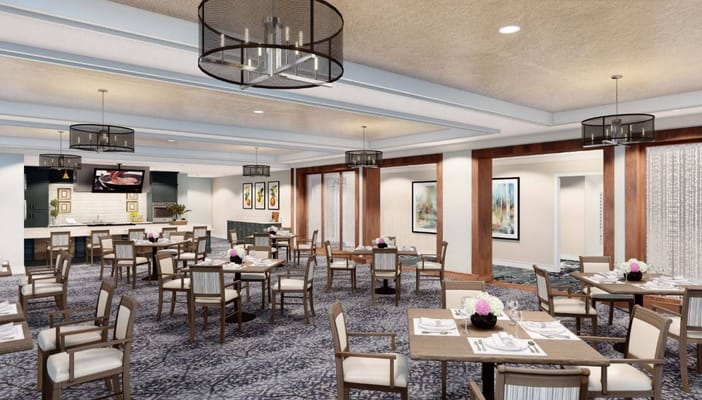 Elegant dining room with tables set for meals