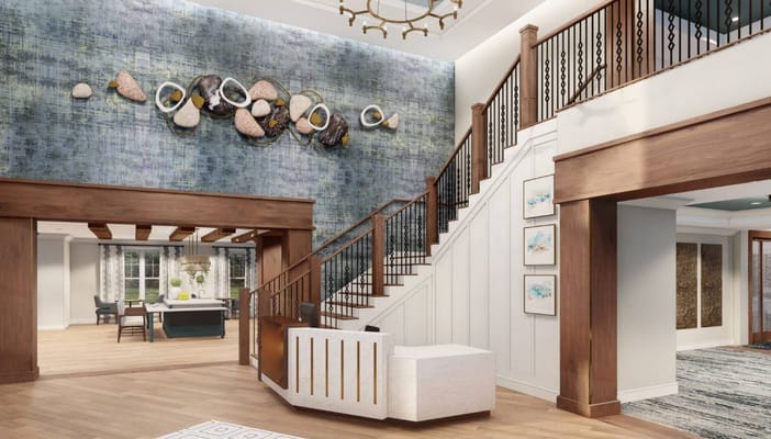 Lobby area with stairway and decorative wall art