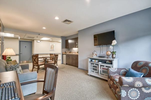 Spacious living room with seating area and kitchenette