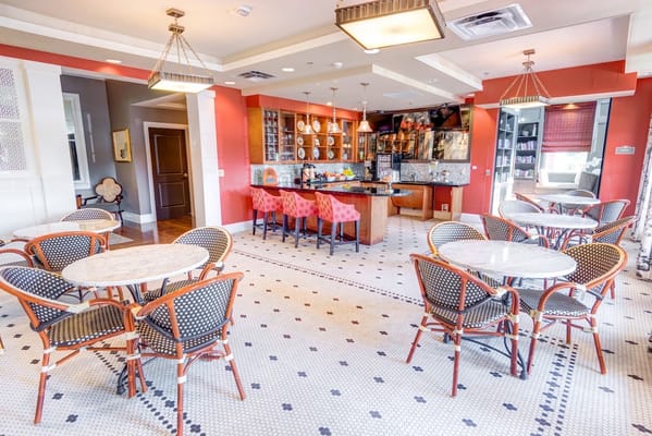 Bright dining area with tables and chairs