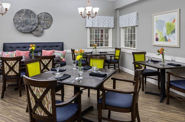 Cozy dining room with tables set for meals