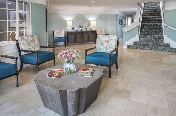 Comfortable seating area in the lobby with floral decor