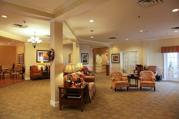 A welcoming common area with comfortable seating and decorative lighting.