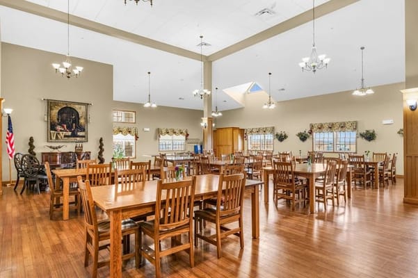 Dining area with wooden tables and chairs