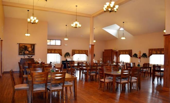 Dining area with wooden tables and chairs