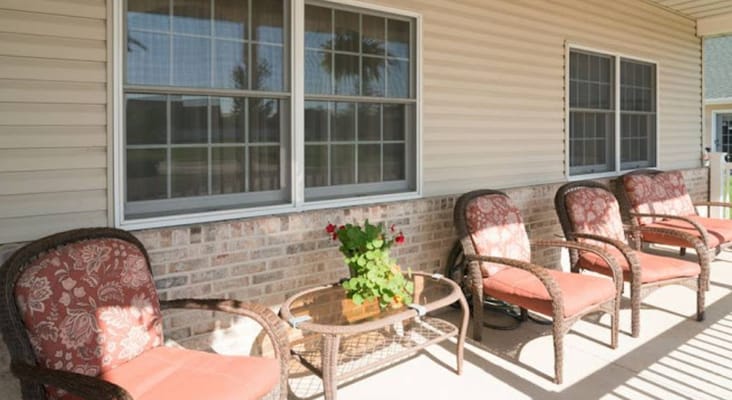 Outdoor patio seating area with flowers