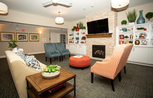Cozy living room area with a fireplace and seating at The Grand Hills Castle