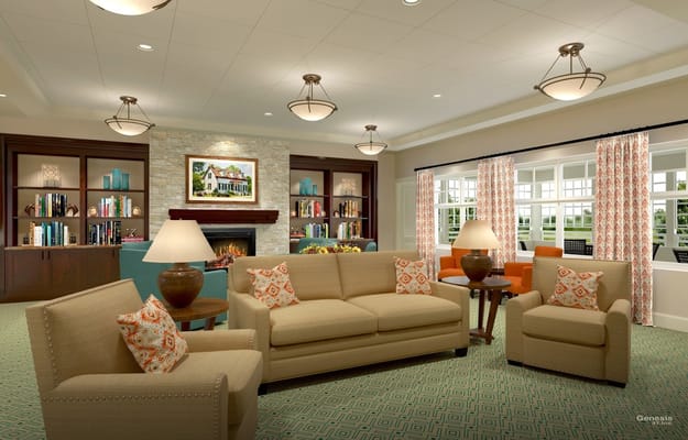 Spacious and inviting living room with comfortable seating and bookshelves.