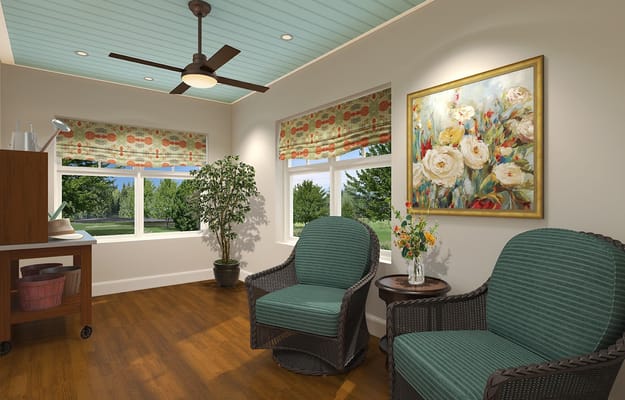 Cozy living area with two rocking chairs, a plant, and artwork