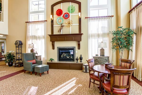 Cozy living room with fireplace and seating.