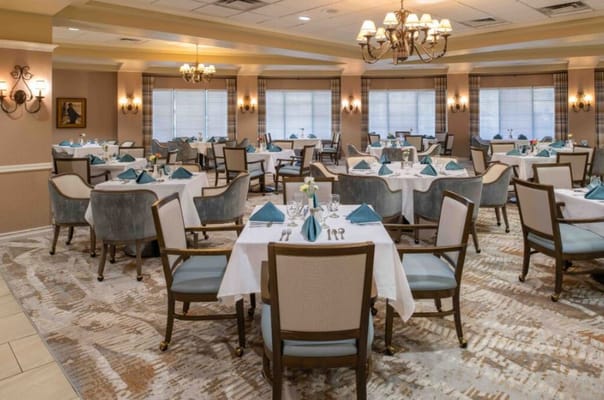 Elegant dining room with tables set for a meal