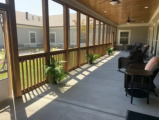 Covered outdoor space with seating and plants