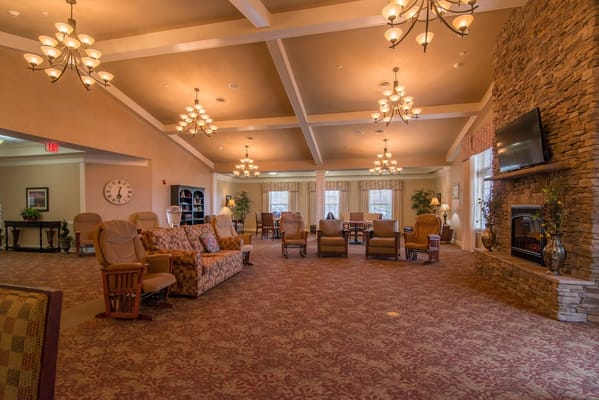Interior of a cozy lounge area with seating and fireplace