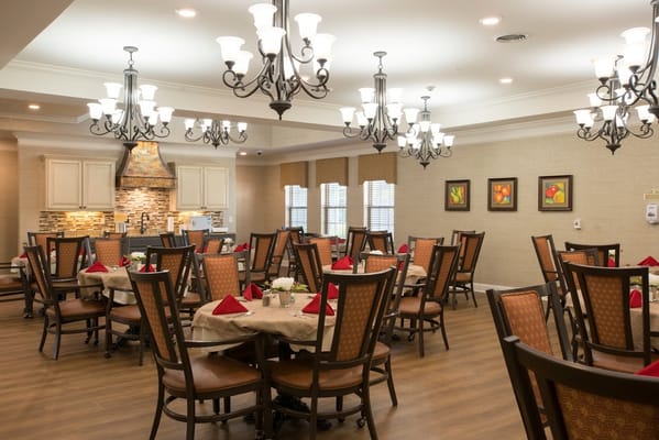Welcoming dining room with tables set for a meal.