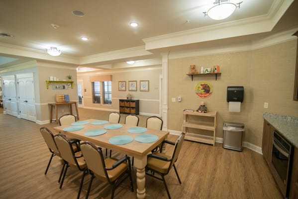 Bright and welcoming dining area with a large table and chairs
