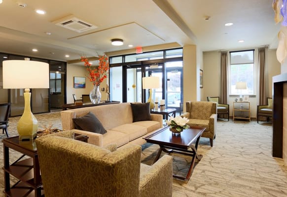 Cozy living room with sofas and lamps at The Lofts by Cogir