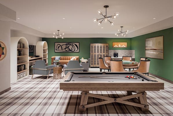 Interior view of the game room featuring a pool table and seating area.