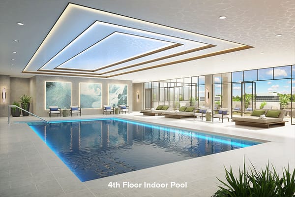 Luxurious indoor pool with seating and artistic decor