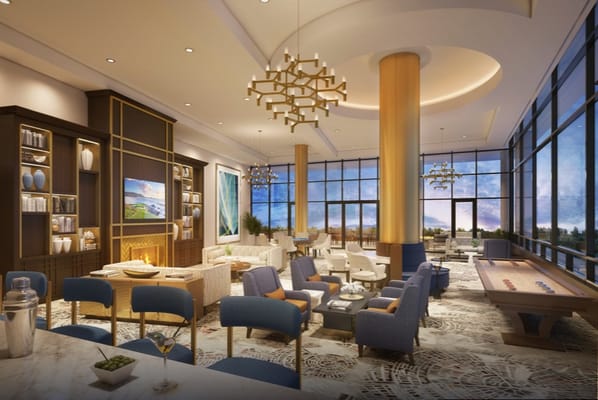 Spacious lounge with modern decor and large windows