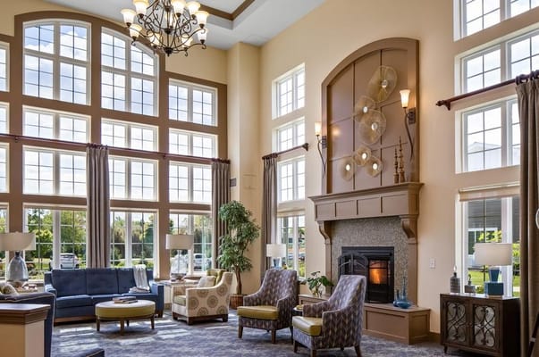 Bright living room with large windows and comfortable seating